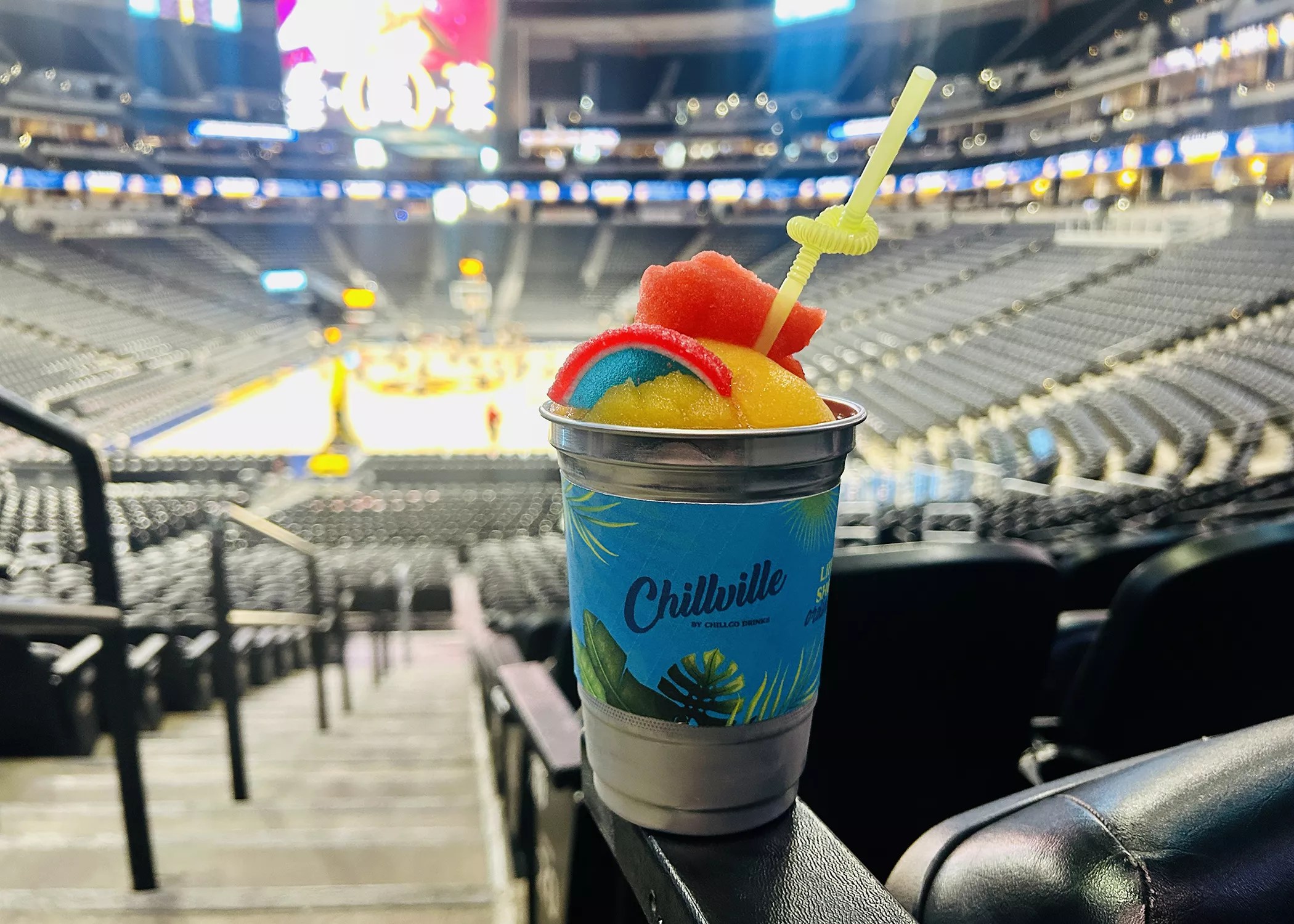a frozen drink in a cup inside an arena