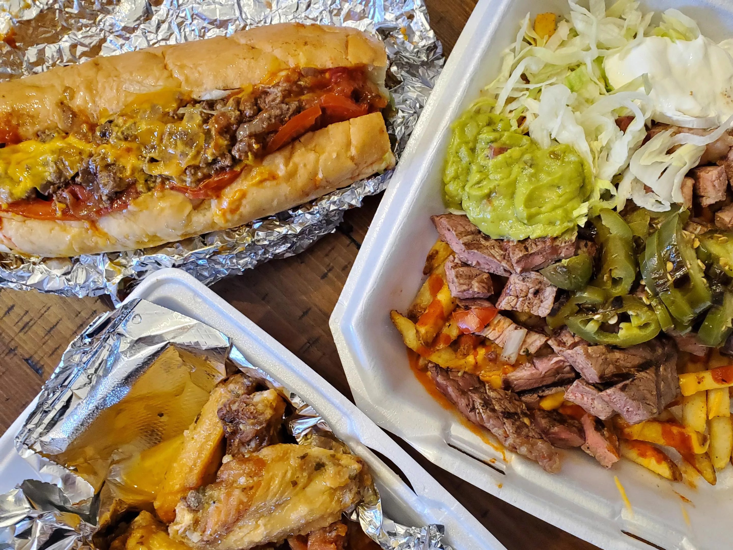 wings, loaded nachos and a chopped cheese sandwich