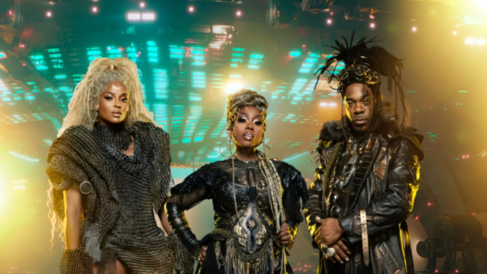 two women and a man in intergalactic outfits