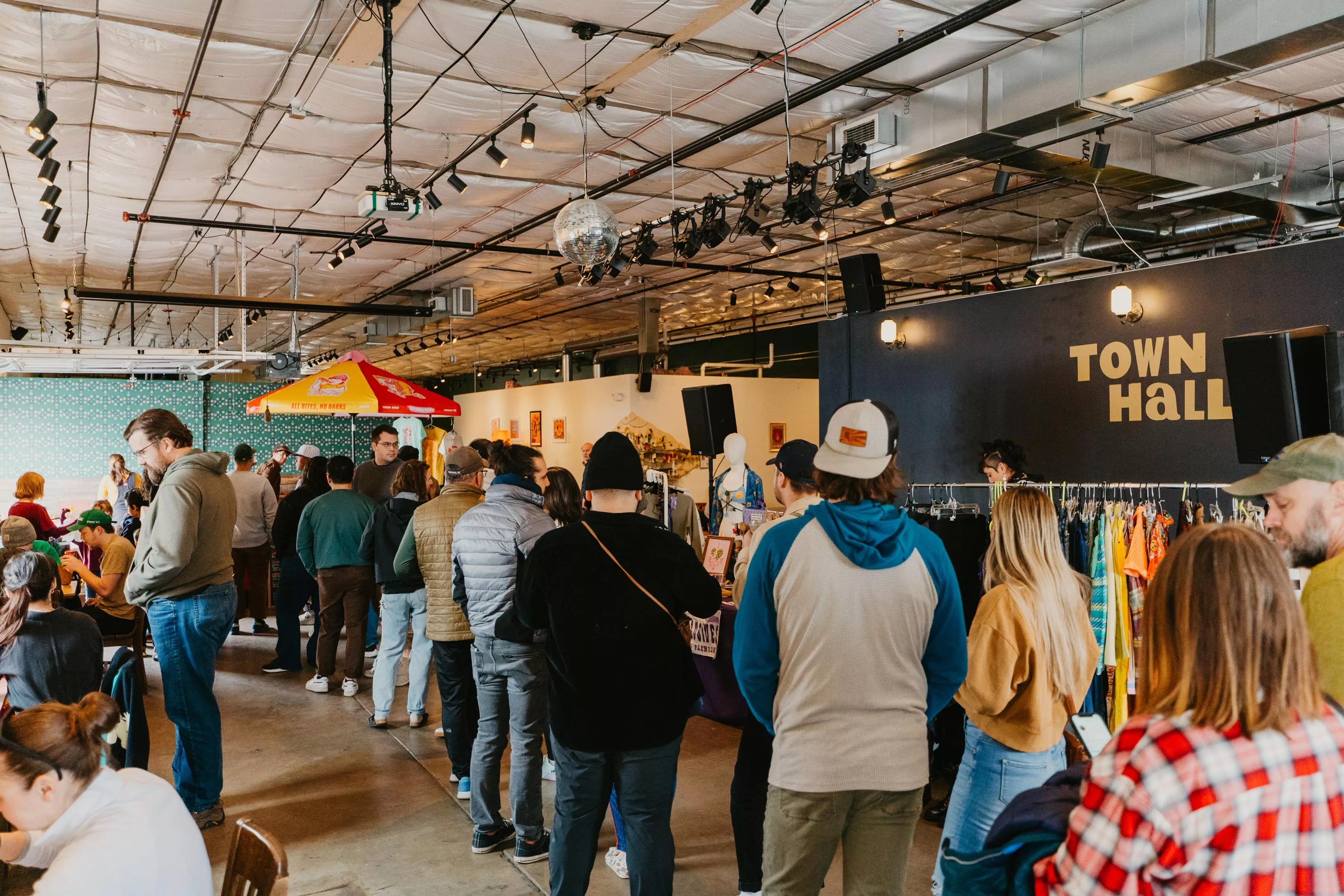 people standing in a line inside a building