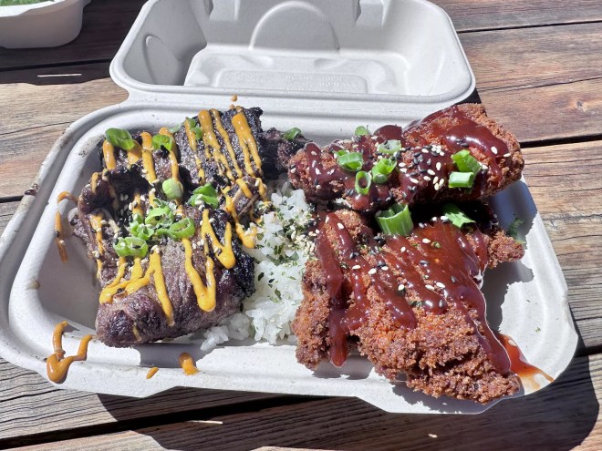 Kalbi short ribs and fried chicken katsu in a to-go box