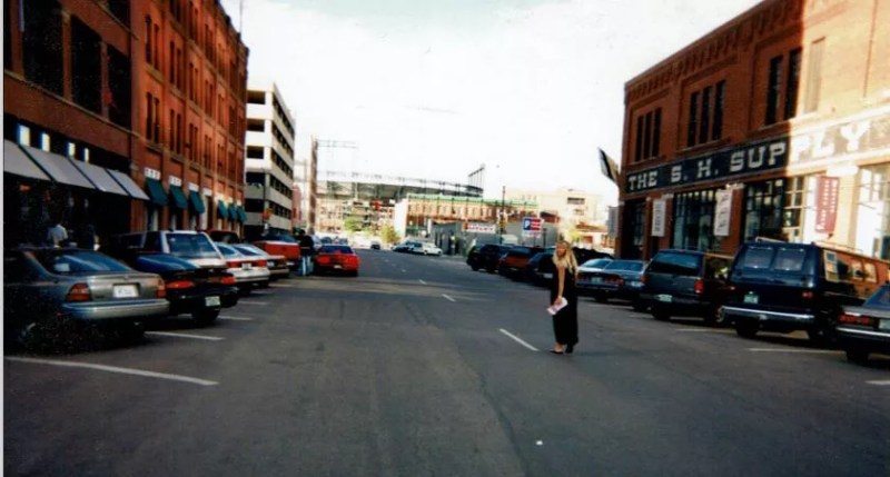 woman walking down a street in denver