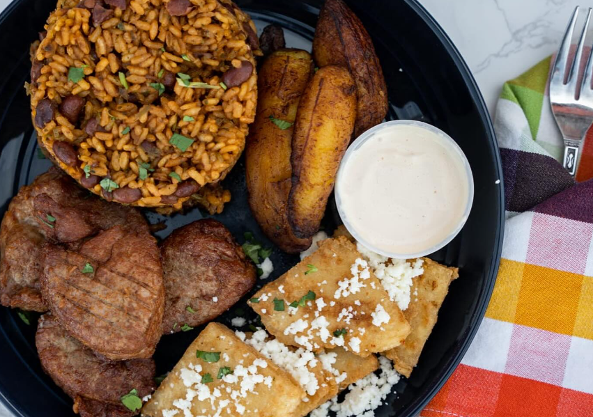 rice and beans, pork and fried tortilla pieces