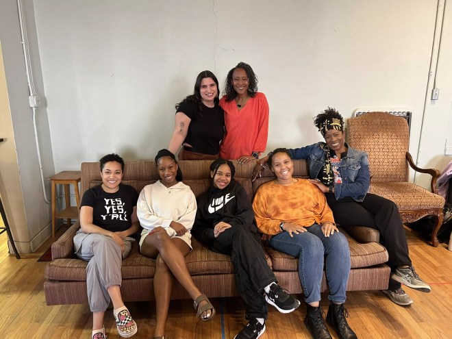 actors sitting on a couch