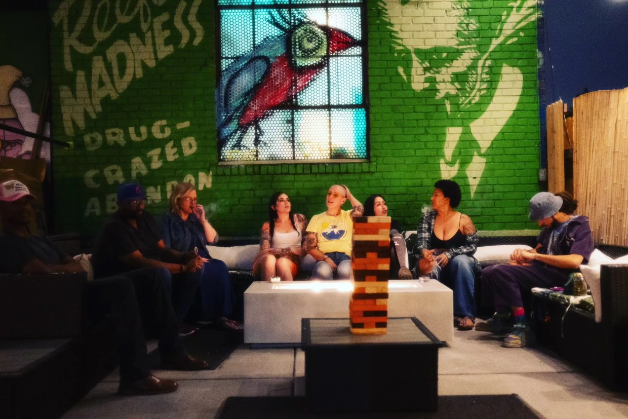 People sit in backyard at night