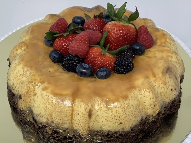 a flan cake topped with berries