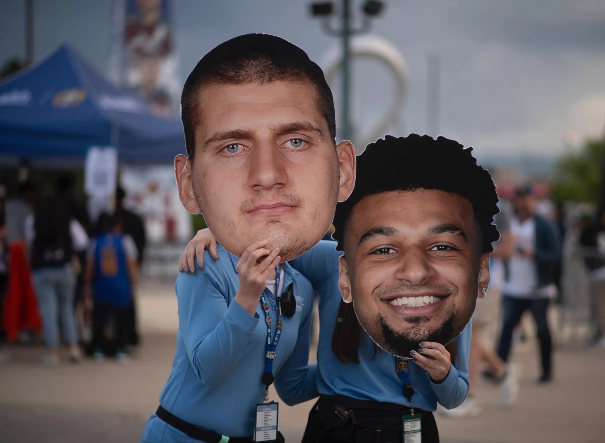 nuggets fans with jokic and murray masks