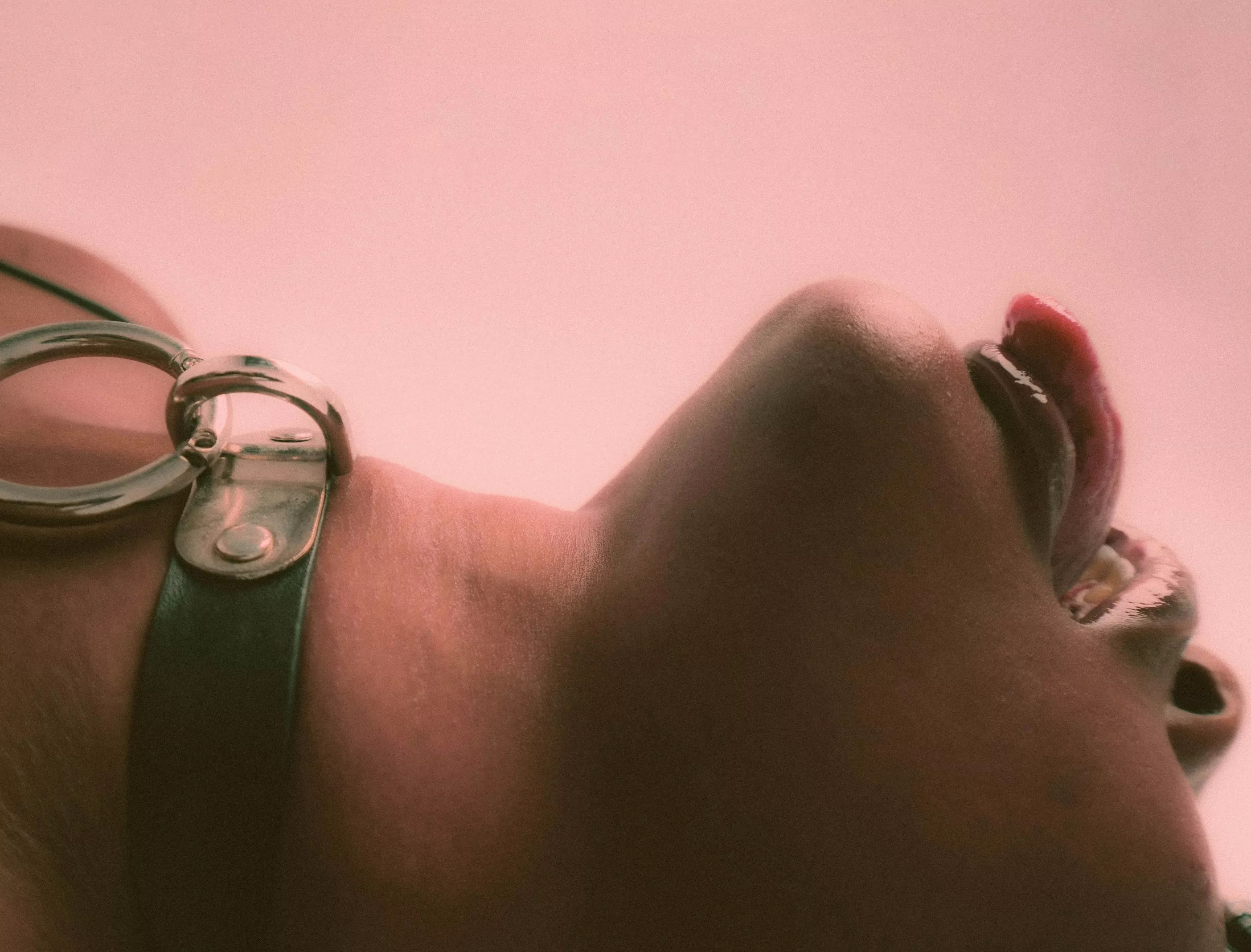 Woman lying down with her tongue out