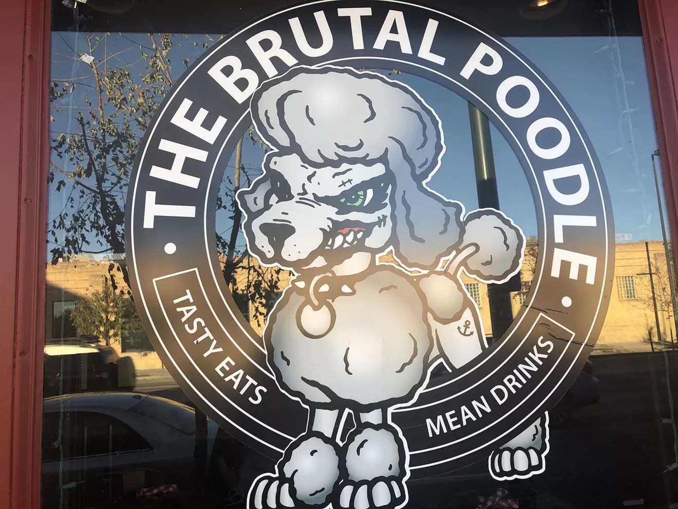 door with poodle sign