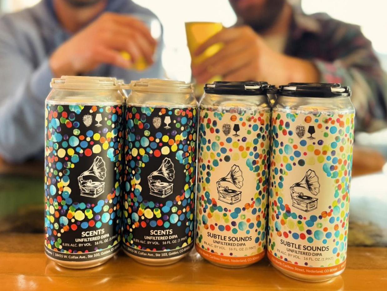 four colorful cans of beer