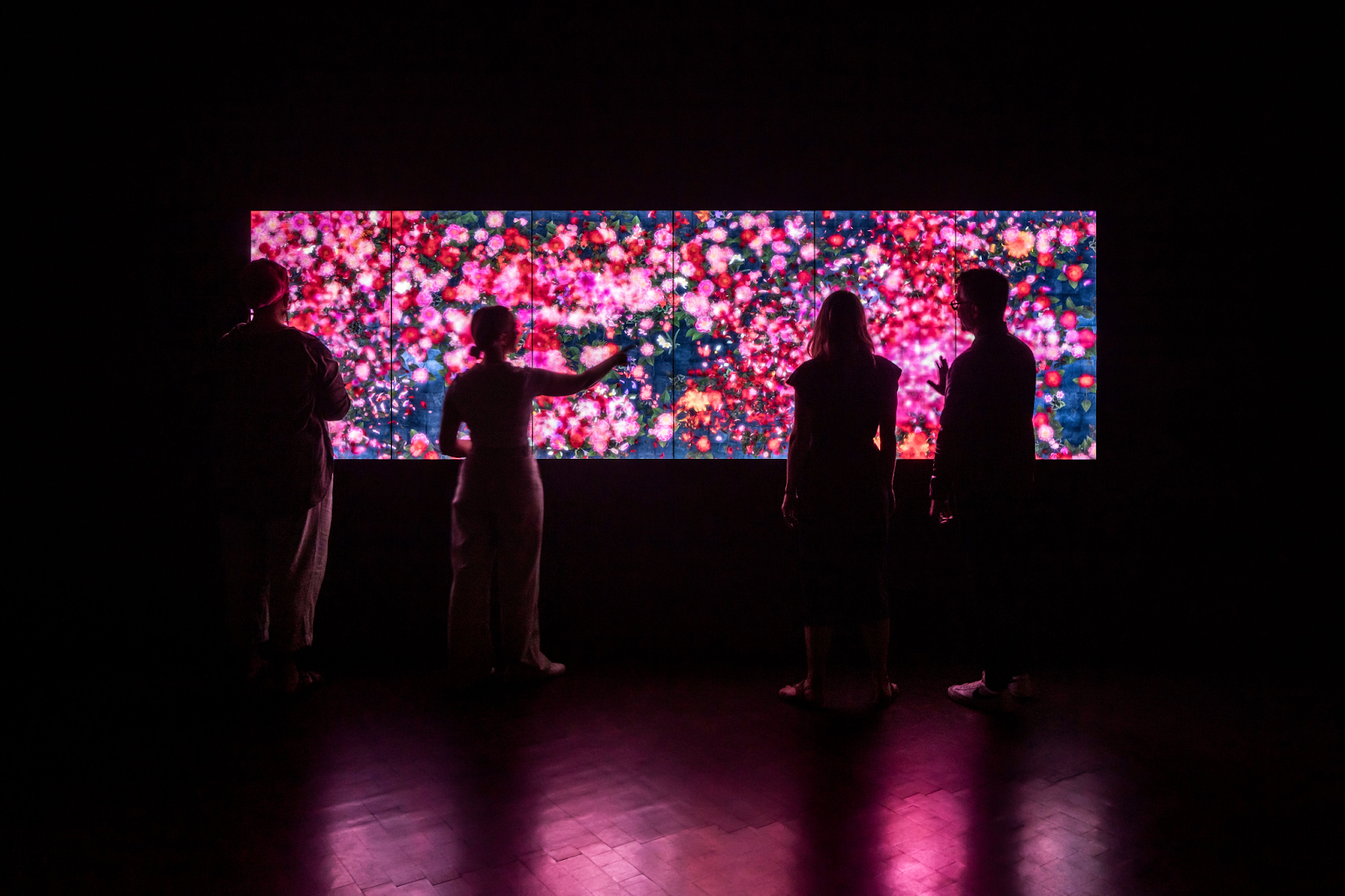 people interacting with an led screen