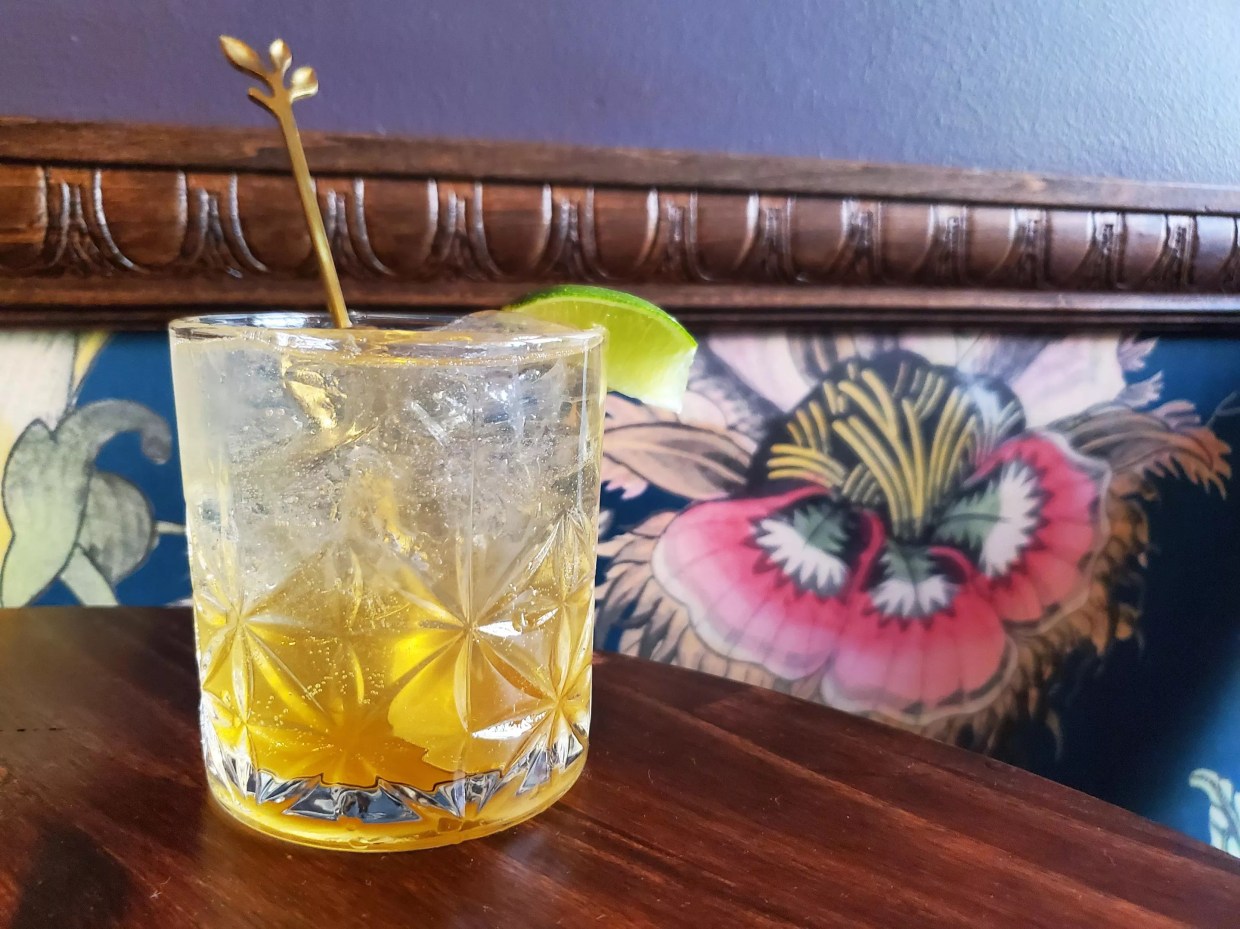 a cocktail on a wooden table