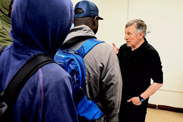 A man talks to people.