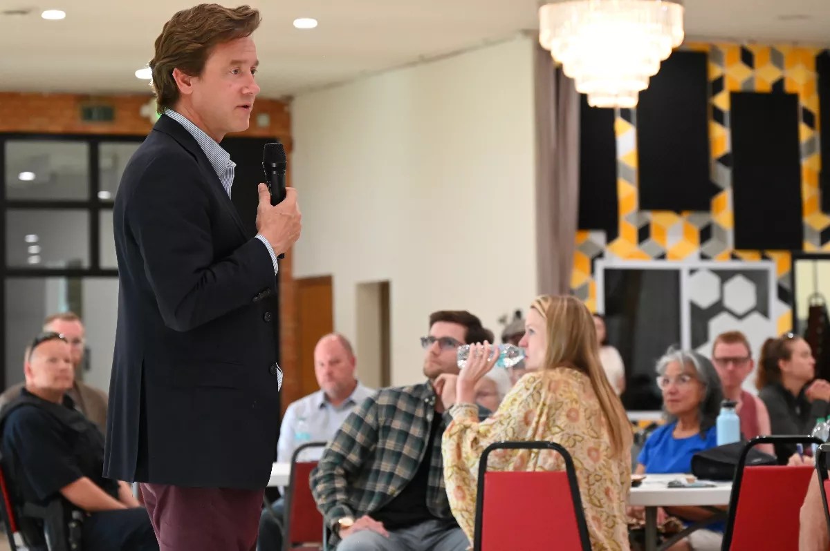 A man talks to people.