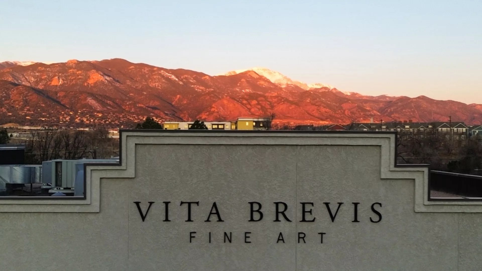 Sunset behind a building