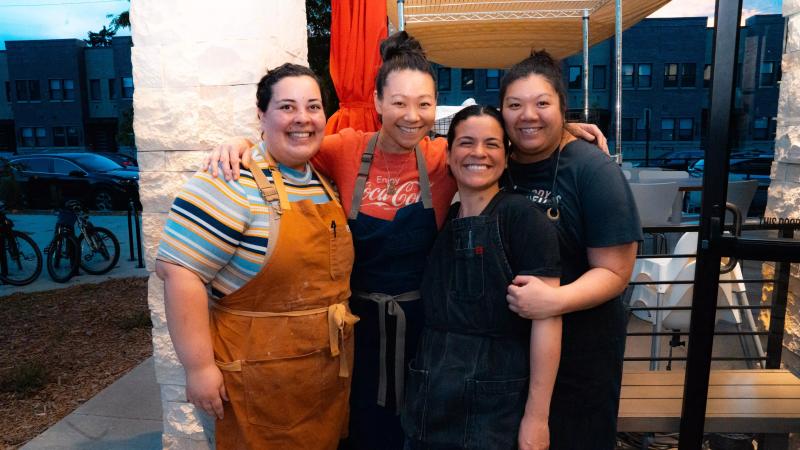 four women in aprons
