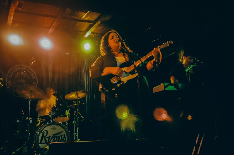 woman singing on stage