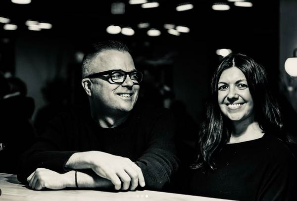 black and white photo of a man in glasses and a woman