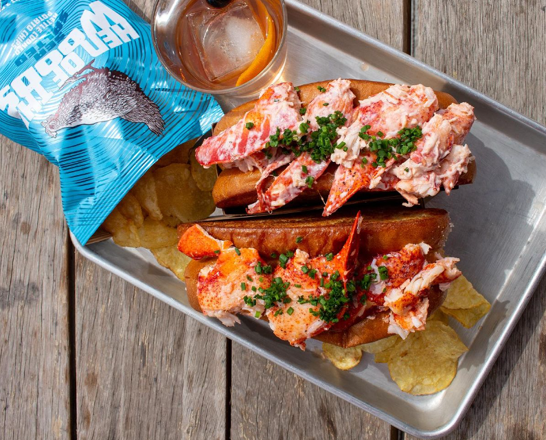 two lobster rolls on a tray