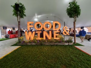 large lit up letters that say "food & wine)