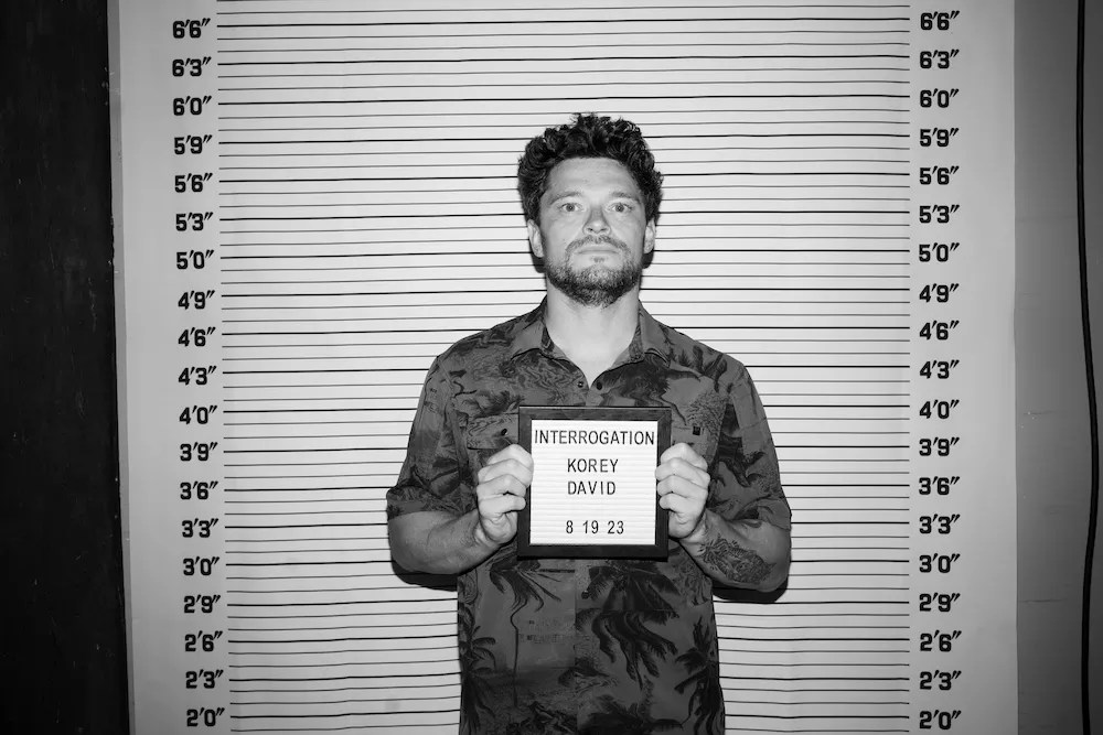 comedian korey david in a pretend mug shot