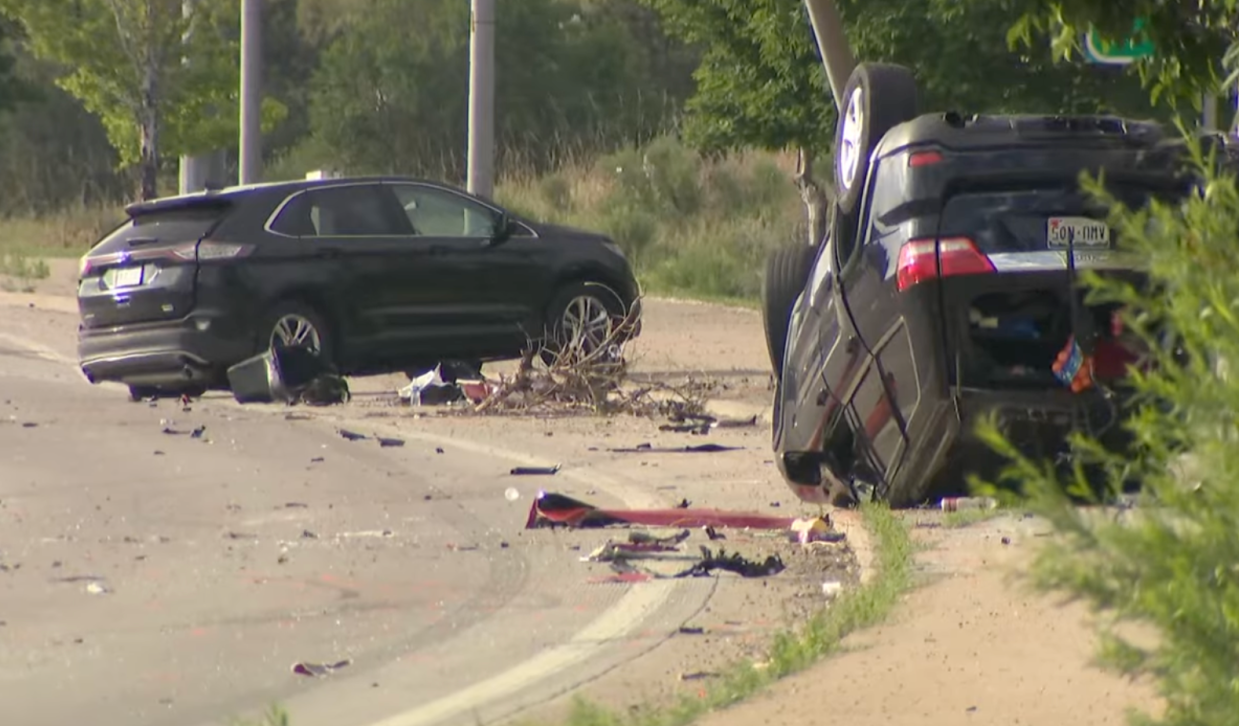 Cars smashed up on a road after an accident.