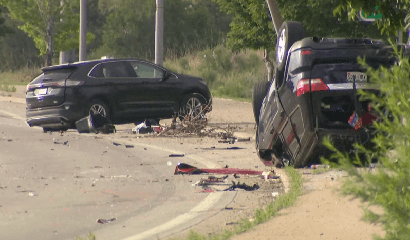 Cars smashed up on a road after an accident.
