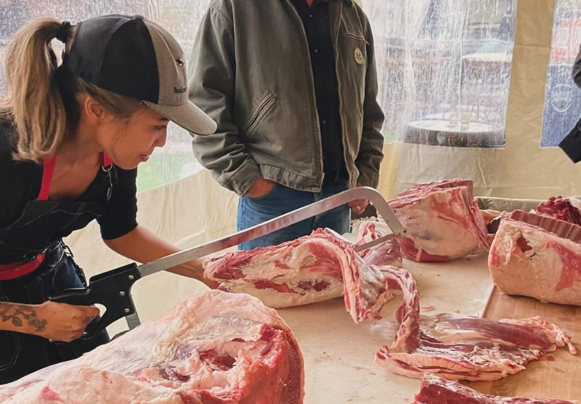 woman butchering meat