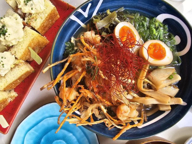 a bowl of ramen with soft boiled eggs