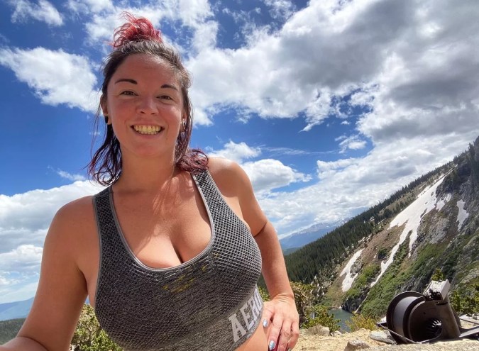 woman smiling on a hike