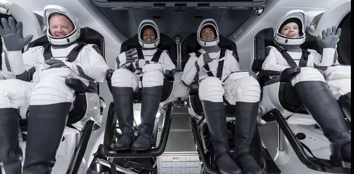 four astronauts coming back from space