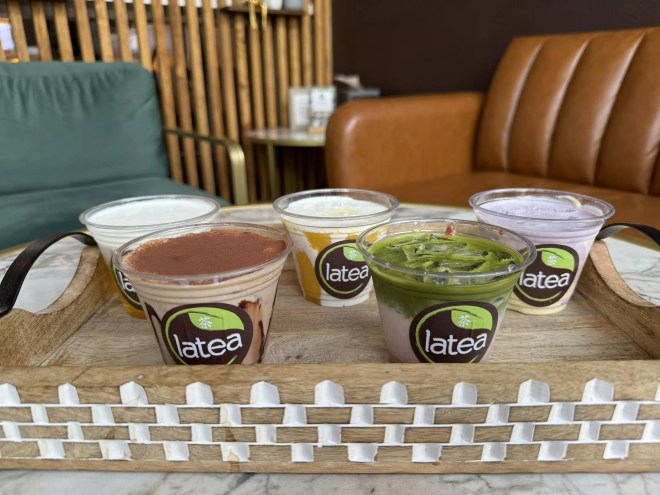 four boba drinks in plastic cups