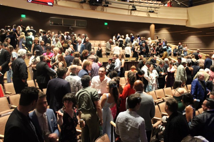 people sitting in an auditorium