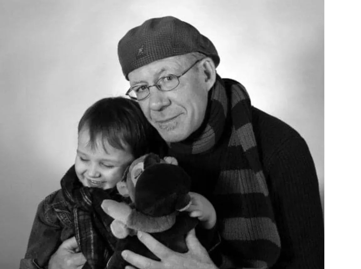 man in beret with boy