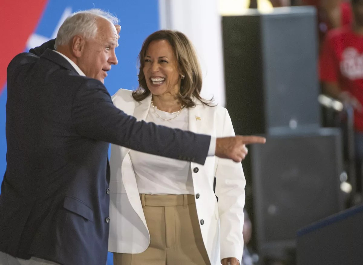 Man in suit, woman in white jacket.