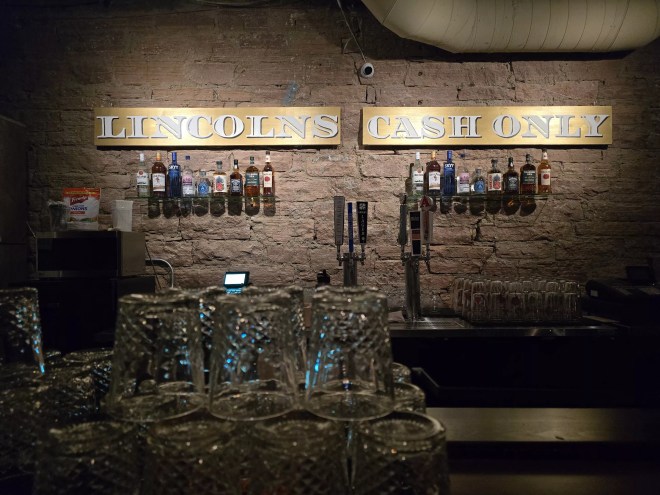 glasses in front of a bar