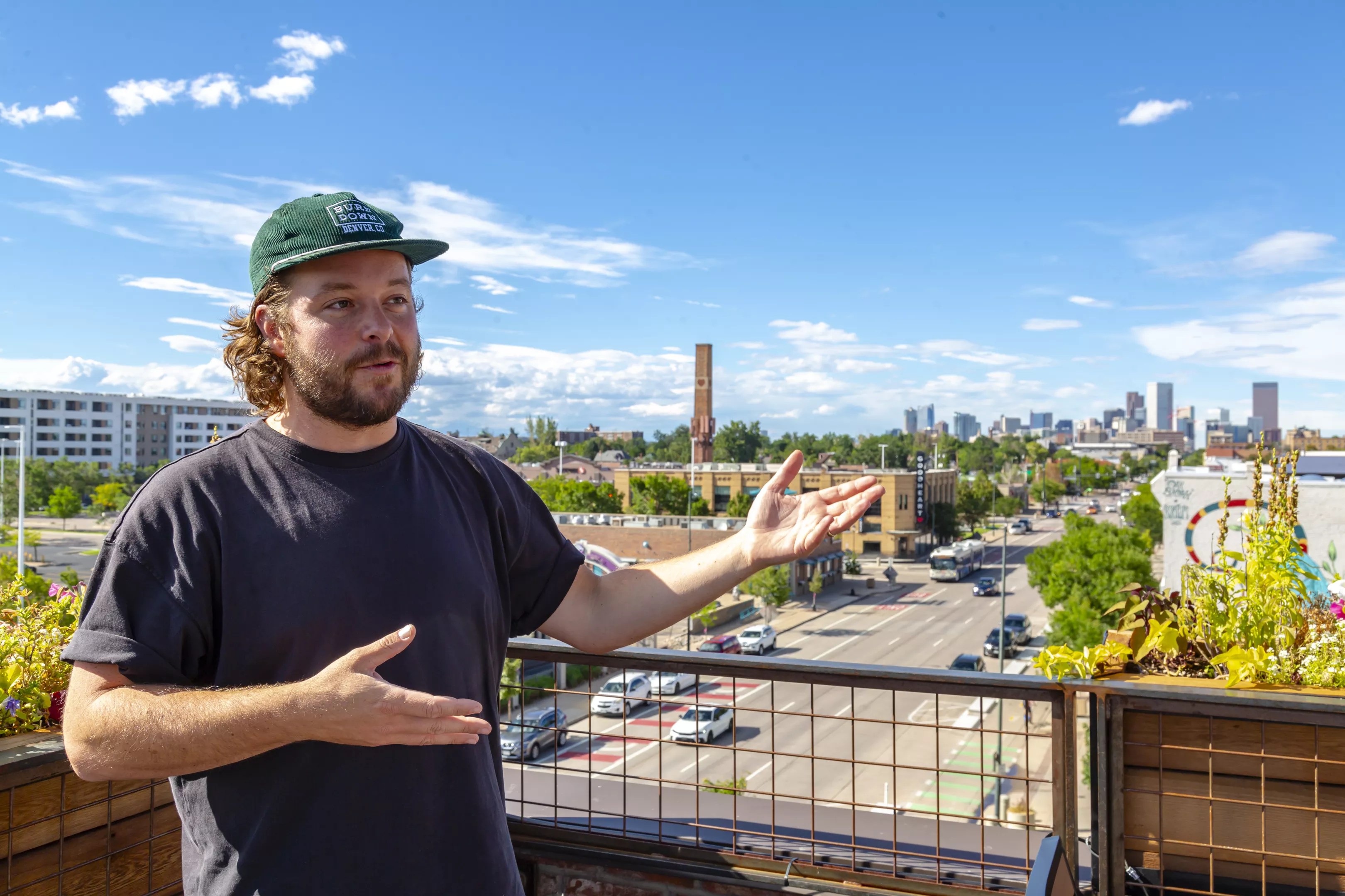 man gesturing at skyline