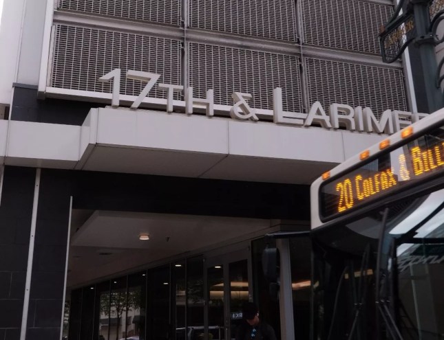 bus and sign outside building
