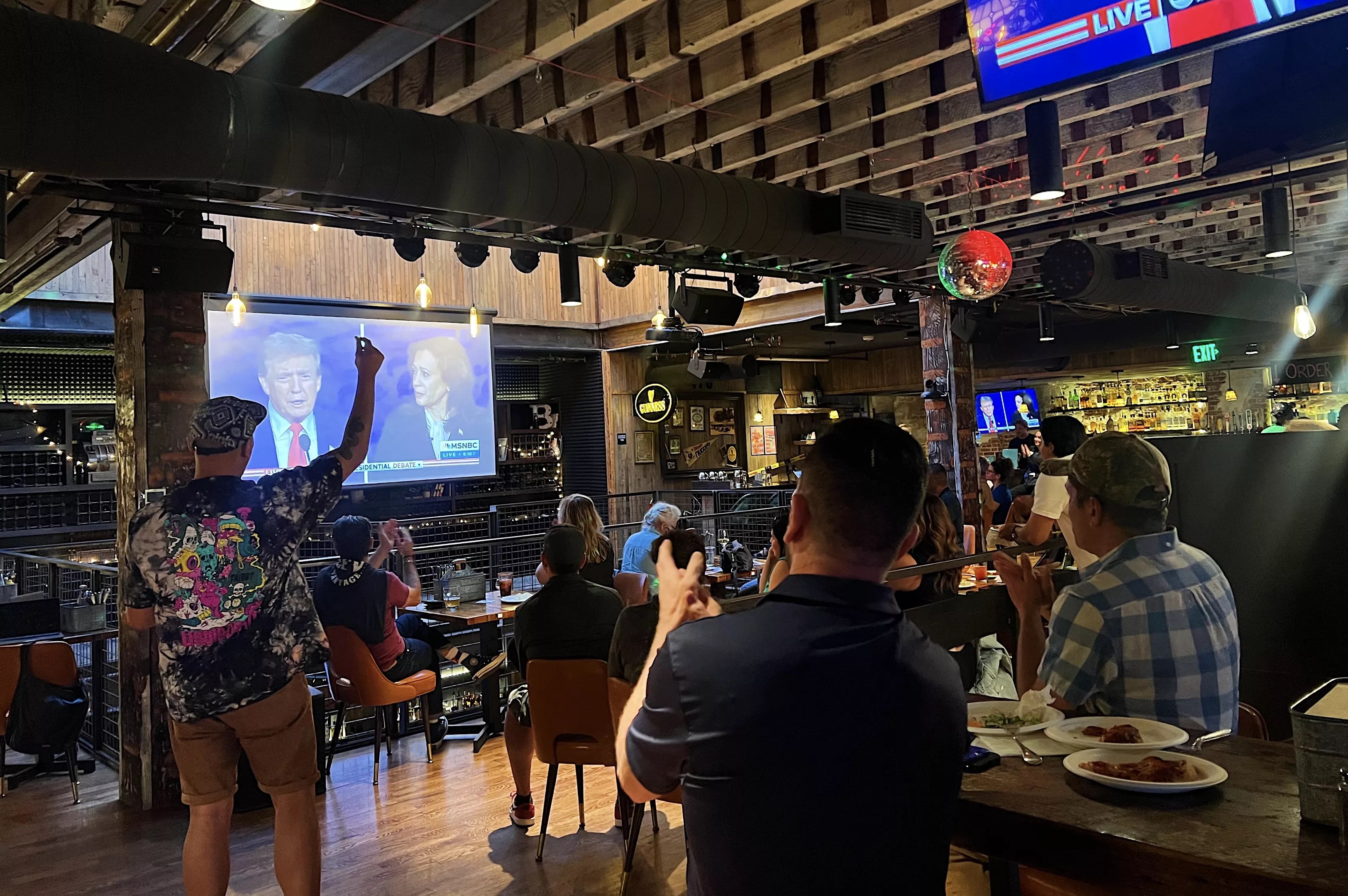 Denver residents watch the presidential debate between Donald Trump and Kamala Harris on Tuesday, September 10.