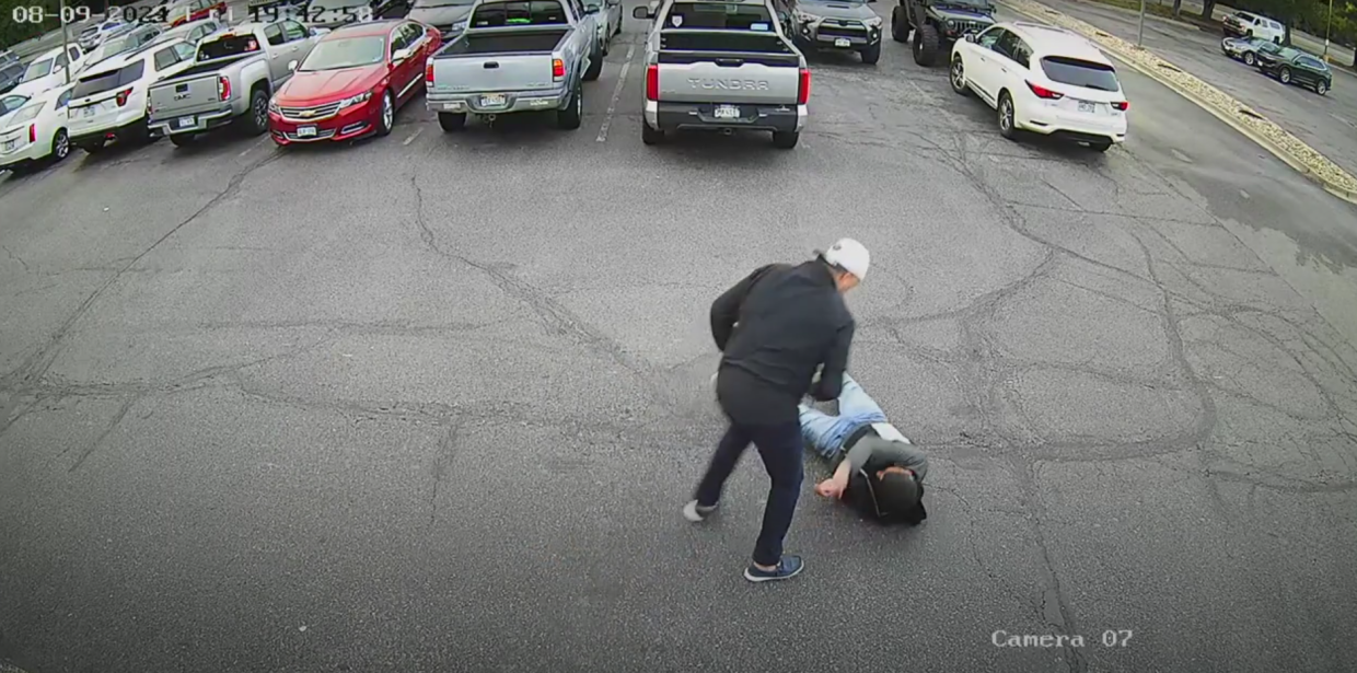 Man stands over knocked out man during fight