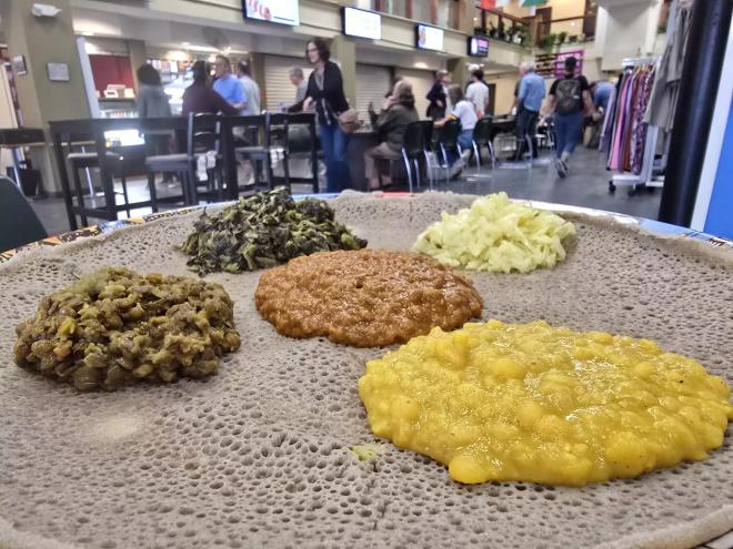 ethiopian injera bread topped with various veggie dishes