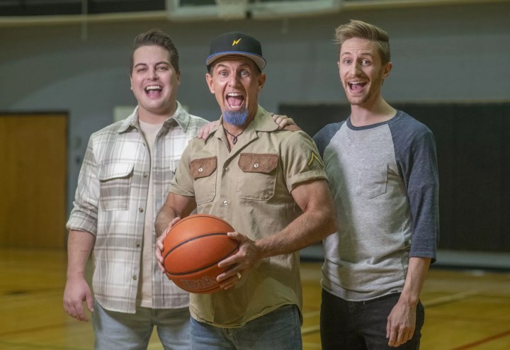 three men with basketball