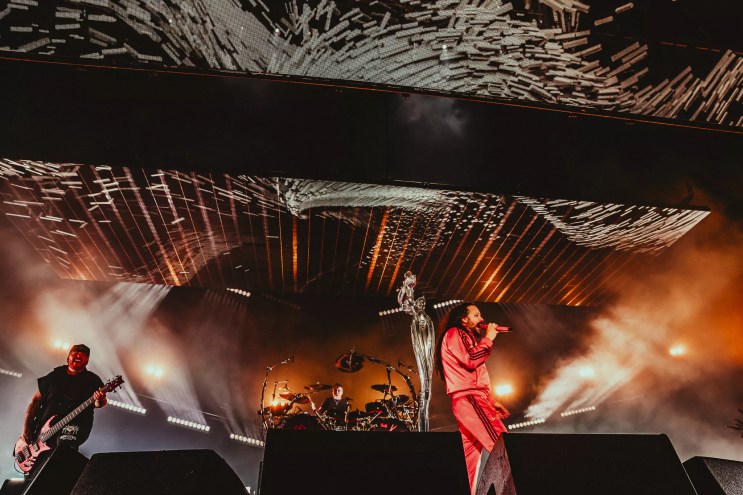 a group of people standing on top of a stage