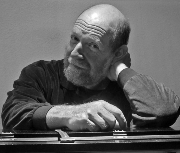 Art Lande sitting at a piano