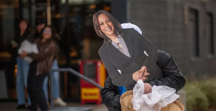 cardboard cutout of Kamala being carried out