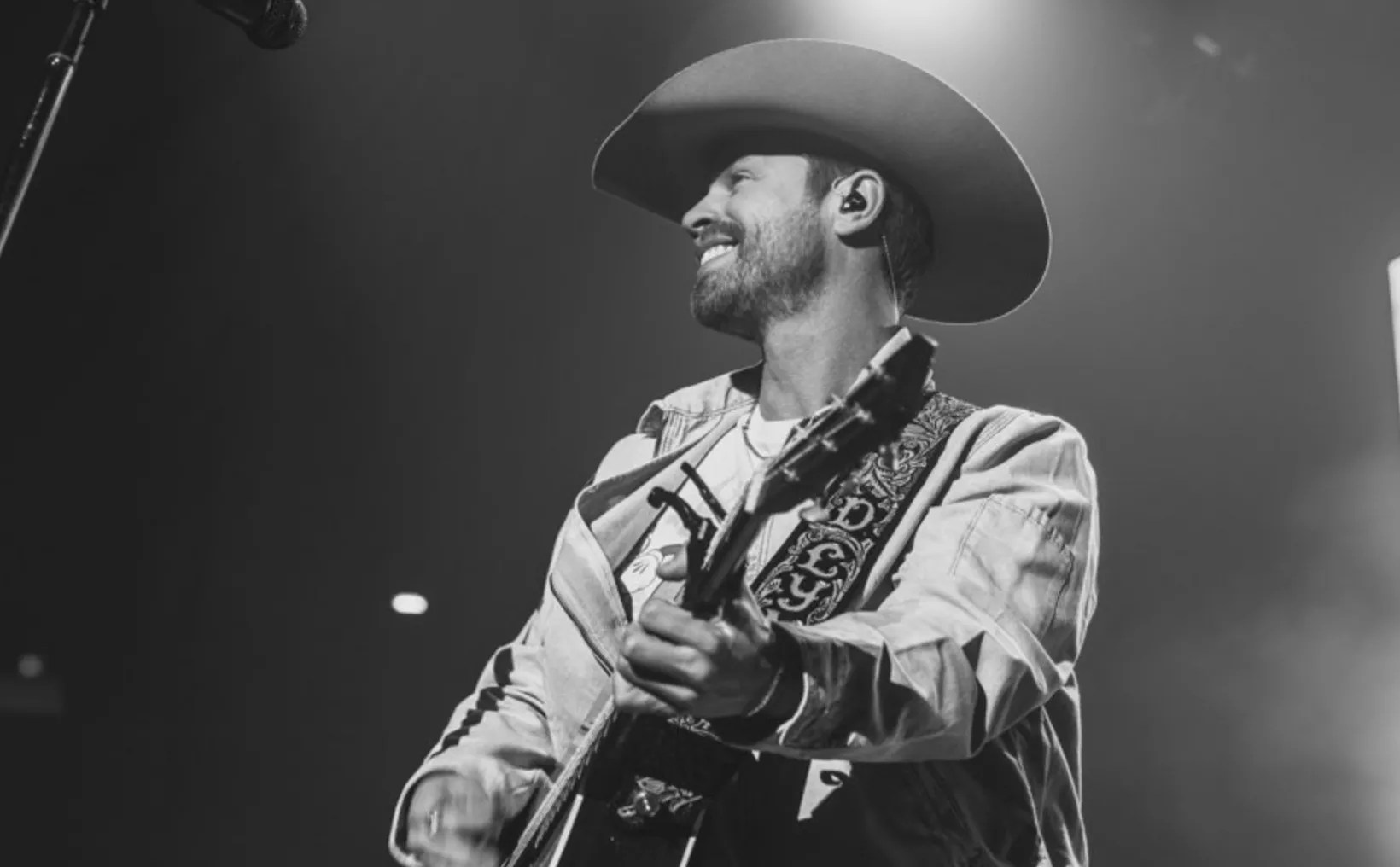 man in cowboy hat playing guitar