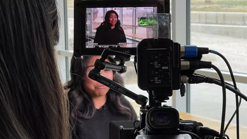 woman behind a camera lens