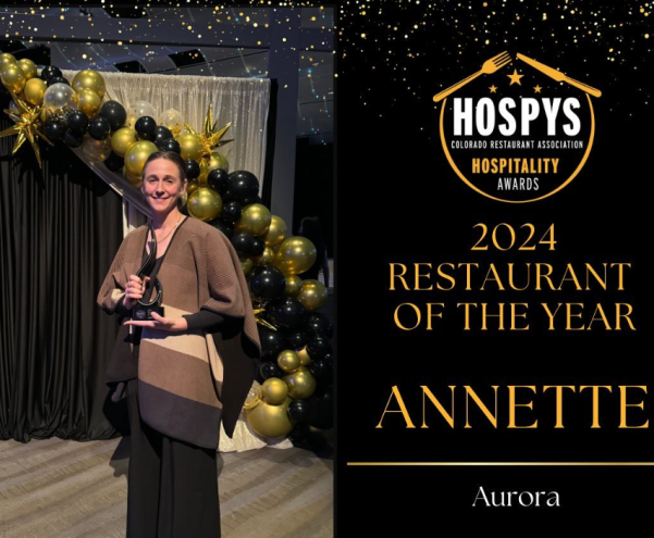 woman holding an award