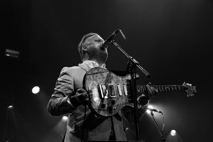 A black and white photo of Modest Mouse