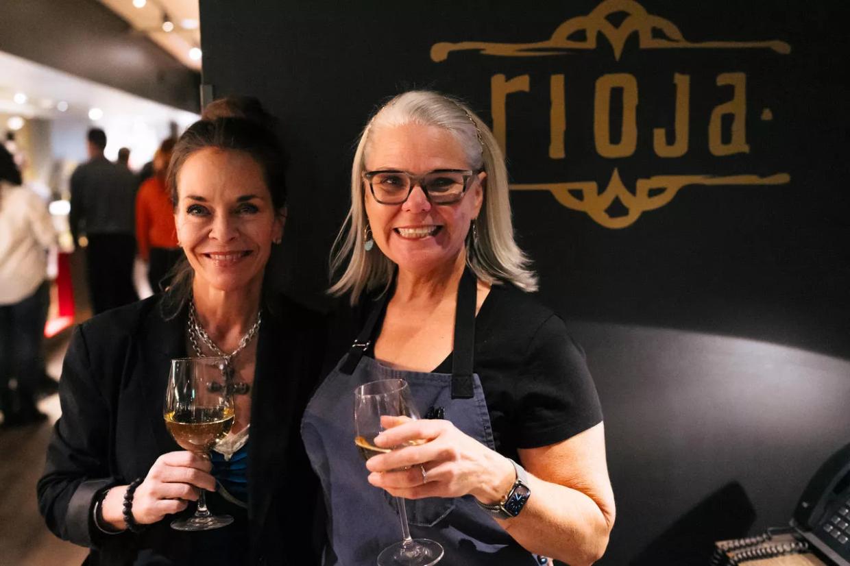 two women toasting